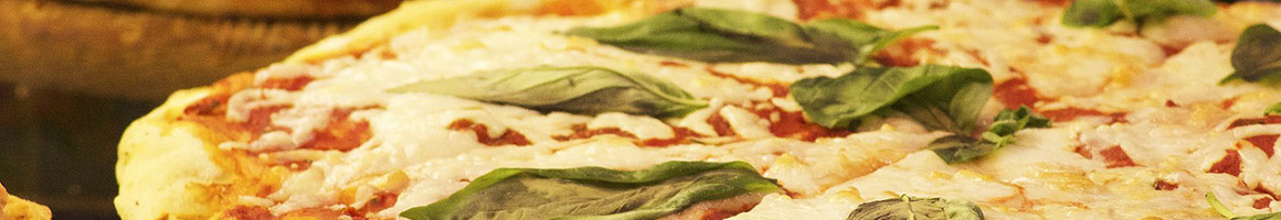 Eating Italian Pizza Sandwich at Louie's Pizza & Italian Grille restaurant in Raymond, NH.